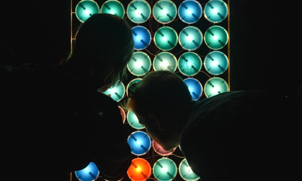 Some people checking an LED screen