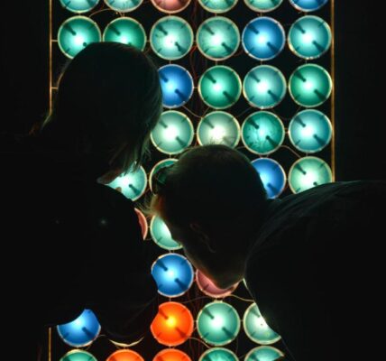 Some people checking an LED screen