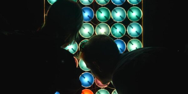 Some people checking an LED screen