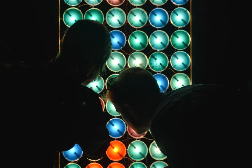 Some people checking an LED screen
